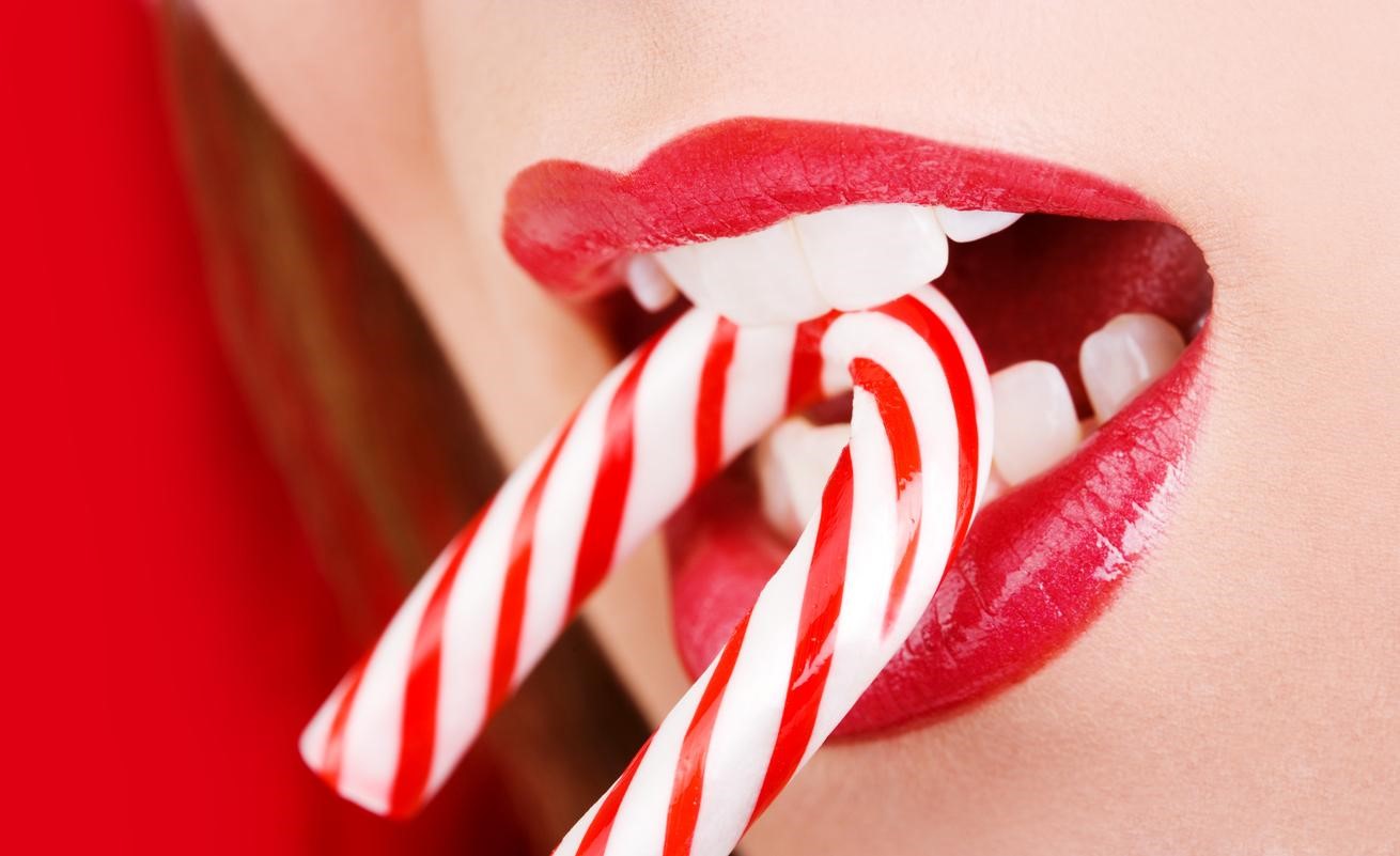 Lady eating a candy cane