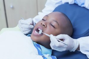 Young patient receiving dental treatments